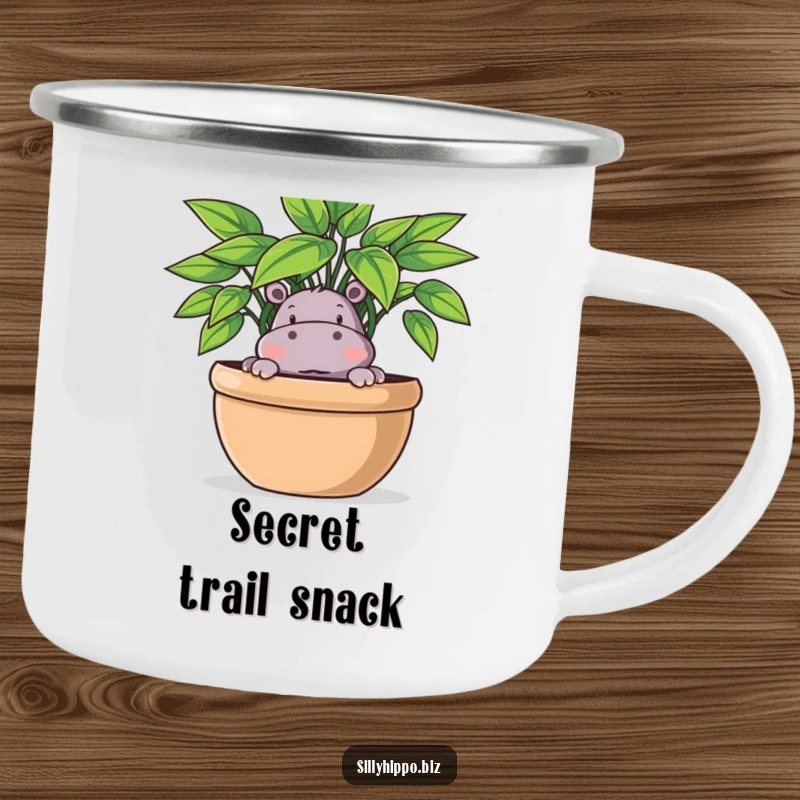 Funny Camping Mug featuring a playful hippo peeking out from behind a large potted plant, perfect for outdoor fun.