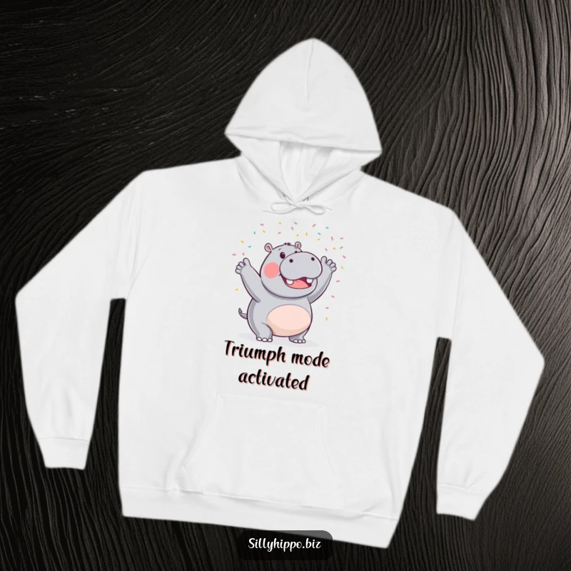 Funny hoodie with a triumphant hippo artistically waving a flurry of tiny celebratory confetti, radiating happiness and cozy vibes.
