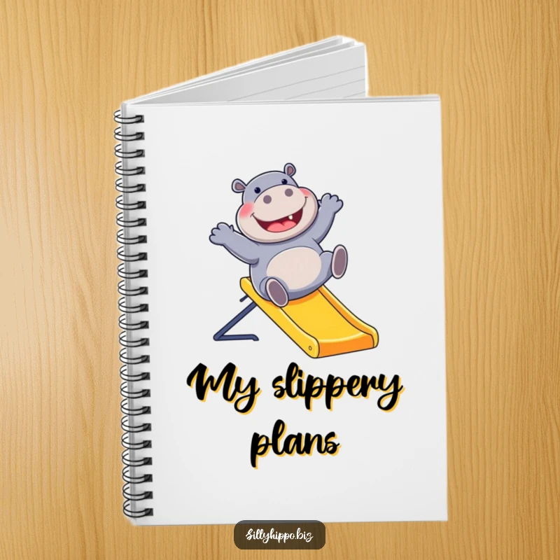 Funny notebook featuring a gleeful hippo sliding down a bright office slide, inspiring fun and creativity for all your writing needs.